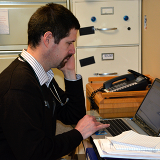 Doctor at desk on laptop